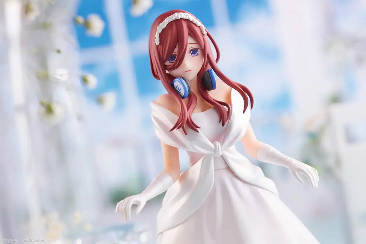 Miku Nakano figure in a classic white bridal dress, holding a bouquet, with a serene expression and a delicate pose.